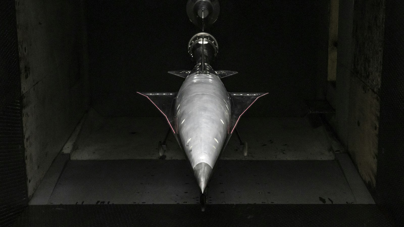 Aerospace wind-tunnel model under aerodynamic test—the physical counterpart to the CFD questions SimScale’s agent can raise from Onshape CAD. Photo: Unsplash.