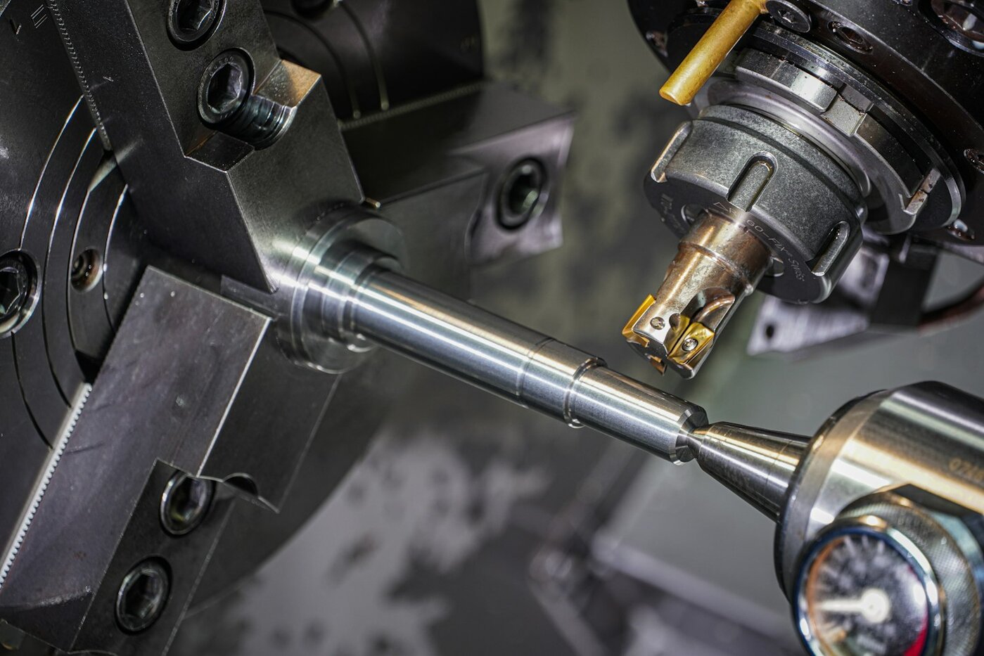 CNC lathe workpiece clamped in a three-jaw chuck—the Mill-Turn setup domain Mastercam 2027 redesigns with visual machine-group workflows. Photo: Unsplash.