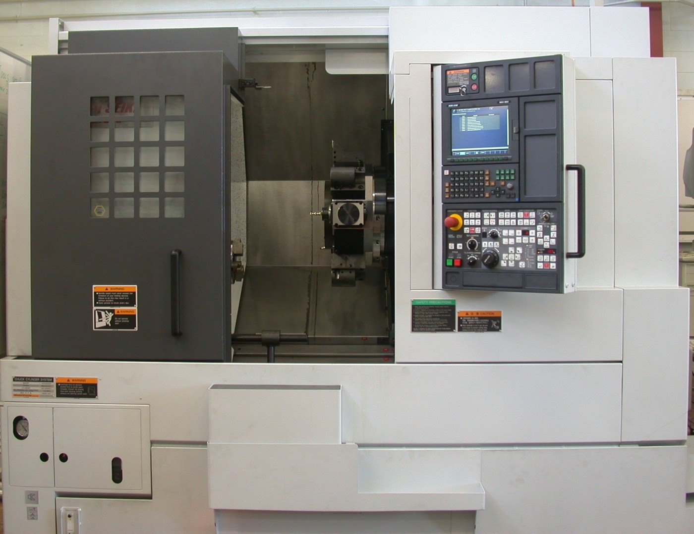 Mori Seiki CNC lathe/mill-turn machine—the multi-task domain GibbsCAM 2027 targets with workspace stock and assembly visualization. Photo: Glenn McKechnie / Wikimedia Commons.