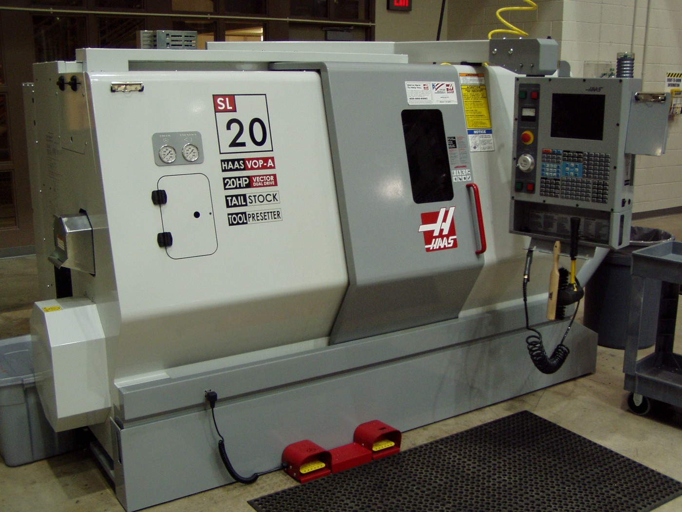 Small CNC turning center on the shop floor—where GibbsCAM GO Operator aims to let floor staff generate NC from approved processes without a full programming seat. Photo: Nathaniel C. Sheetz / Wikimedia Commons.