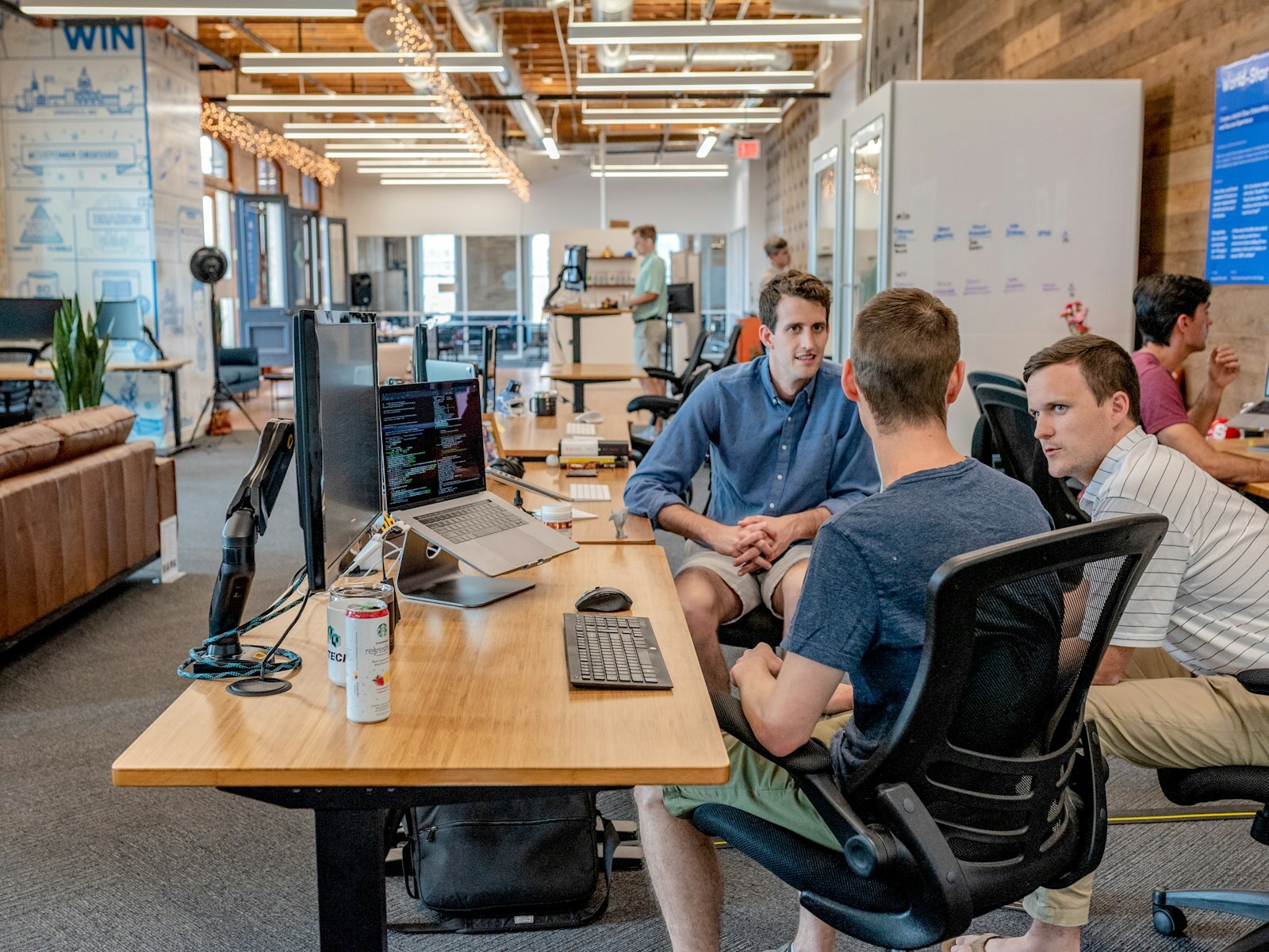 Operations team collaborating at a desk—the people-centric frontline Daikin’s SAP Cloud ERP pilot aimed to simplify. Photo: Unsplash.