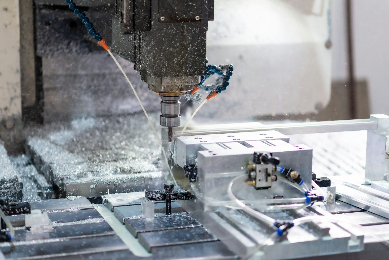 Close-up of aluminum CNC milling with coolant and precision metal cutting
