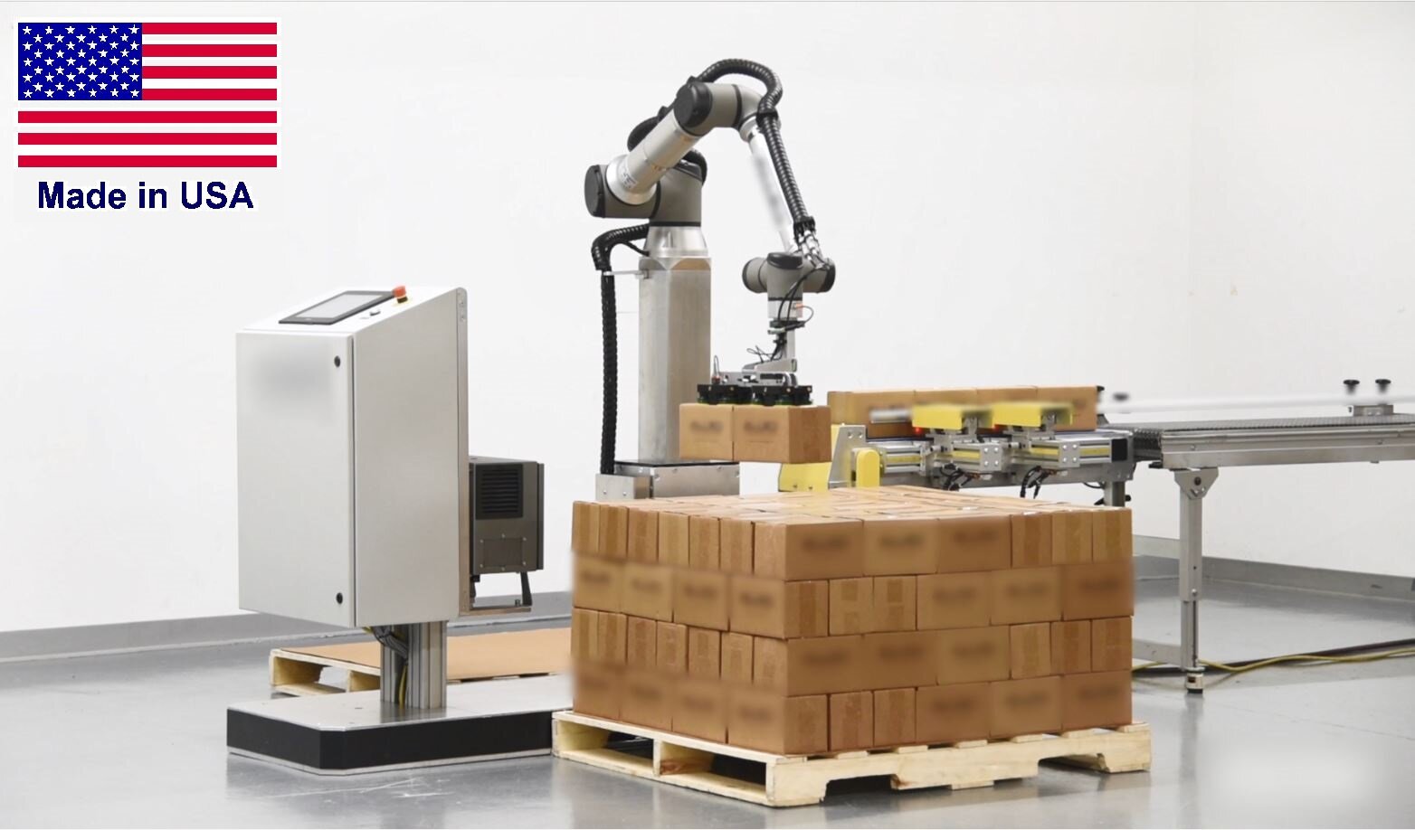Collaborative robot palletizer on a factory floor—the class of industrial cell where certified ultrasonic safety sensing is shipping. Photo: Wikimedia Commons.