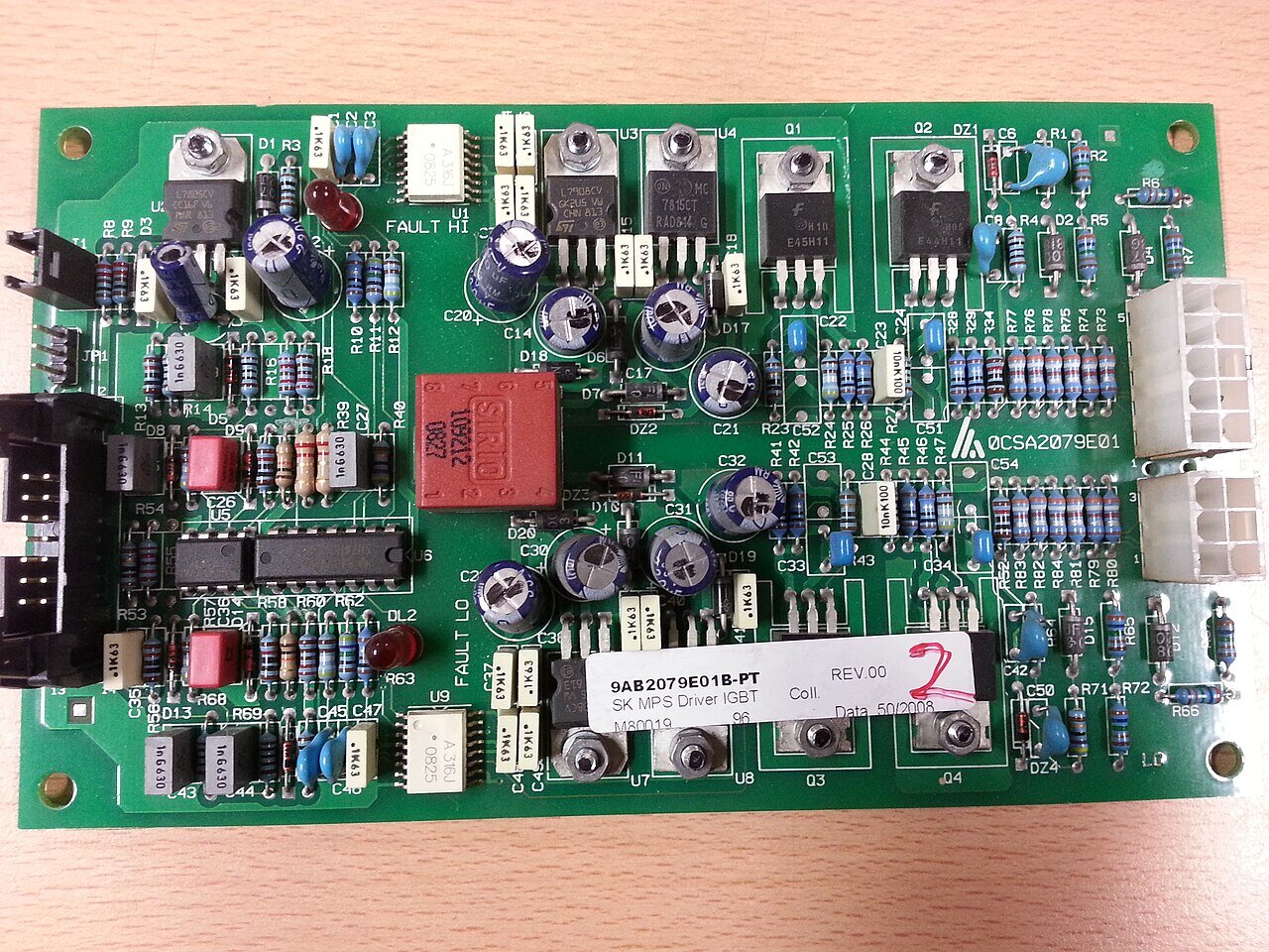 Close-up of a printed circuit board—the embedded surface where safety-certified Rust firmware has to run. Photo: Wikimedia Commons.