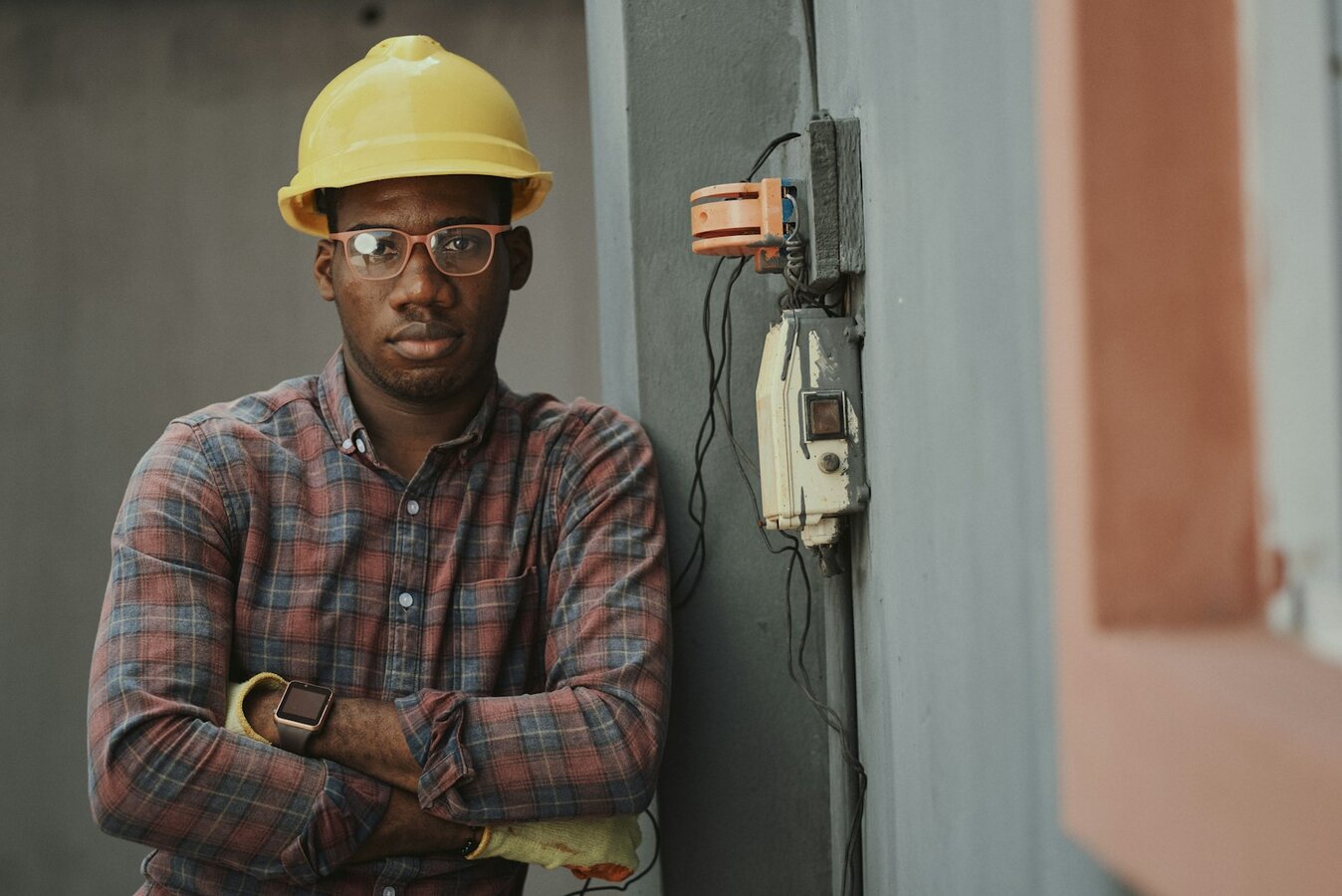 Technician at work on industrial equipment—shop-floor evidence auditors will expect for quality culture under ISO 9001:2026. Photo: Unsplash.