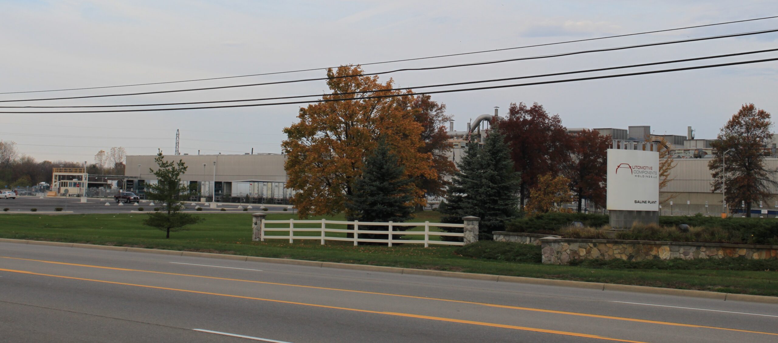 Automotive Components Holdings Saline Plant, a Michigan Tier 1 supplier, seen from the road in autumn.