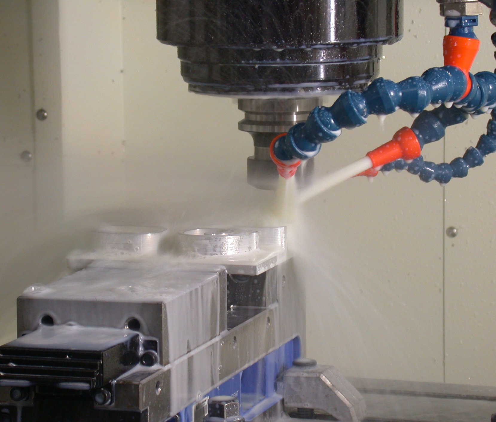 Coolant directed onto a cutting tool during milling on a Makino S33 machining center.