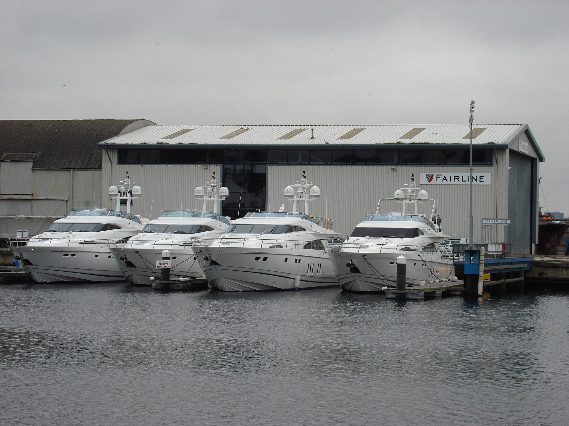 Fairline testing facility in Ipswich with four yachts moored alongside