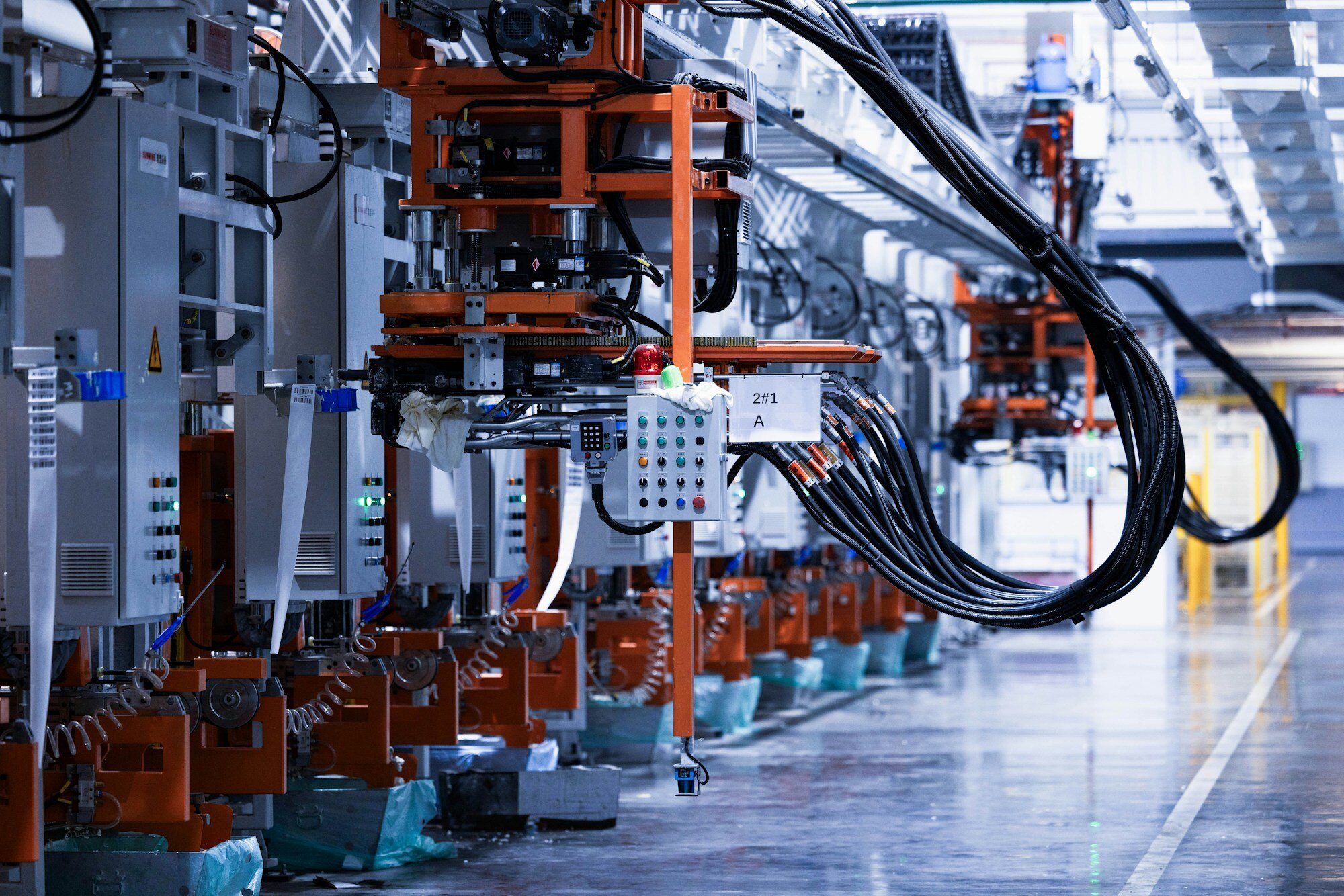Close-up of foaming machinery on a refrigerator manufacturing line—where change, EBOM, and supplier AML decisions hit the floor. Photo: Homa Appliances / Unsplash.